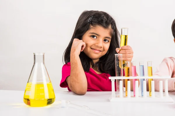 4 year old indian girl doing science experiment, science Education. asian kid and science experiment, chemistry experiment, indian girls and science experiments, indian girl and science