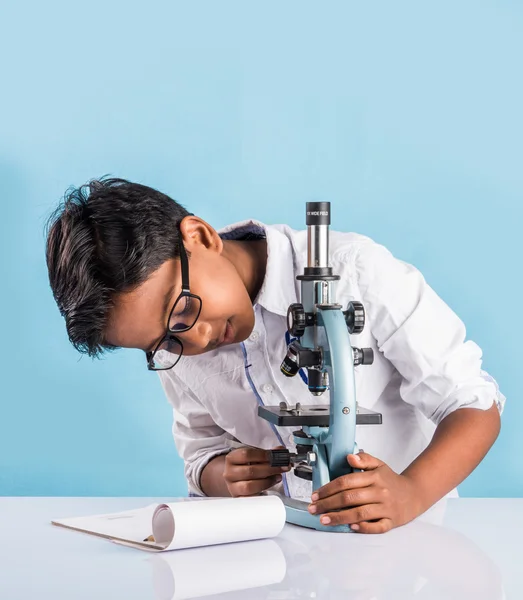 Indian boy and microscope, asian boy with microscope, Cute little kid holding microscope, 10 year old indian boy and science experiment, boy doing science experiments