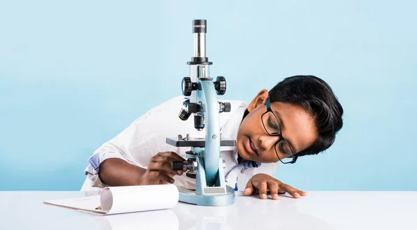 Indian boy and microscope, asian boy with microscope, Cute little kid holding microscope, 10 year old indian boy and science experiment, boy doing science experiments