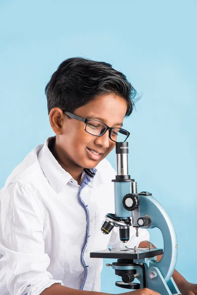 Indian boy and microscope, asian boy with microscope, Cute little kid holding microscope, 10 year old indian boy and science experiment, boy doing science experiments