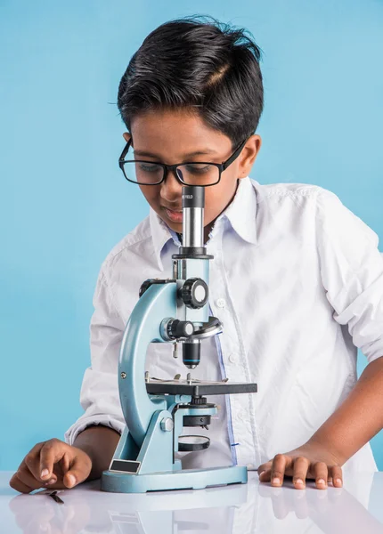 Indian boy and microscope, asian boy with microscope, Cute little kid holding microscope, 10 year old indian boy and science experiment, boy doing science experiments
