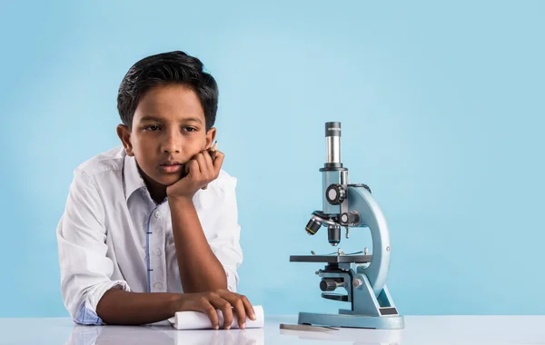 Indian boy and microscope, asian boy with microscope, Cute little kid holding microscope, 10 year old indian boy and science experiment, boy doing science experiments