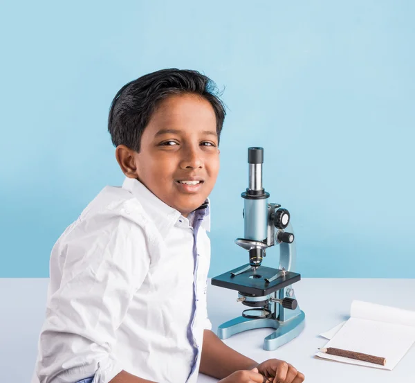 Indian boy and microscope, asian boy with microscope, Cute little kid holding microscope, 10 year old indian boy and science experiment, boy doing science experiments