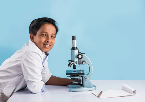 Indian boy and microscope, asian boy with microscope, Cute little kid holding microscope, 10 year old indian boy and science experiment, boy doing science experiments