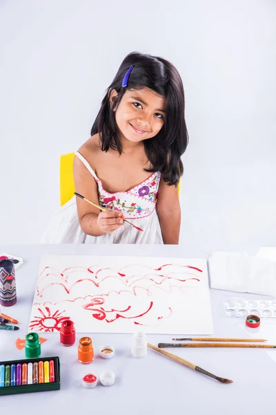 Indian girl colouring or painting, asian girl with paint brush