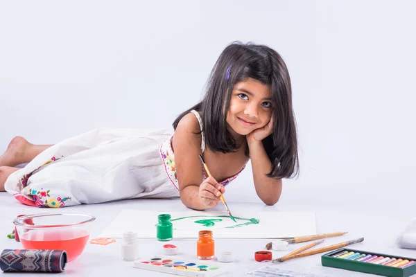 Indian girl colouring or painting, asian girl with paint brush