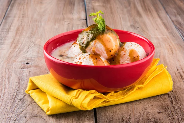Dahi vada or dahi vade also known as Curd Vadai in South India, a popular snack famous all over India prepared by soaking lentil vadas in thick dahi or yogurt, topped with spicy & sweet chutney etc