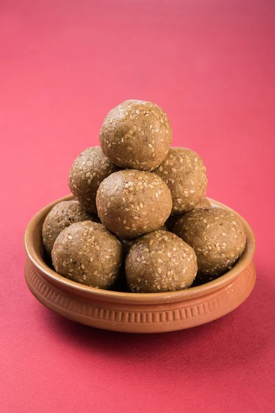 Indian sesame sweet or tilgul laddu, made up of jaggery and sesame seeds, hand made, round, indian sweet prepared in Makar Sankranti festival