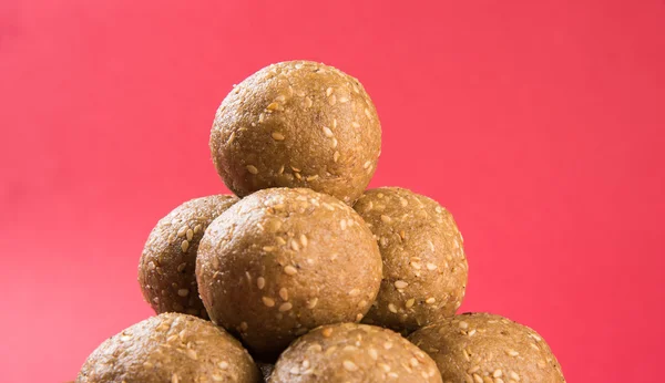 Indian sesame sweet or tilgul laddu, made up of jaggery and sesame seeds, hand made, round, indian sweet prepared in Makar Sankranti festival