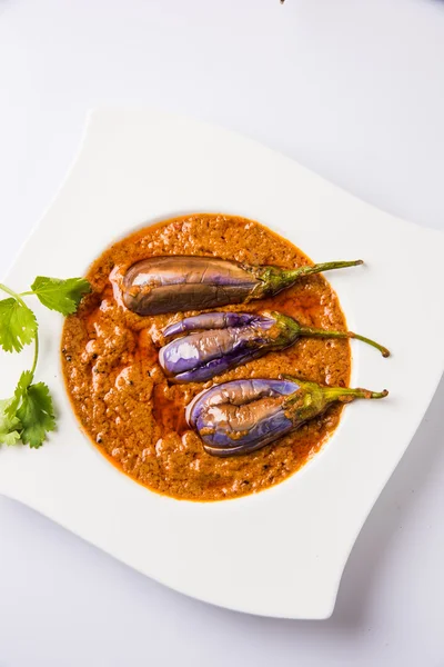 Egg plant south indian curry, brinjal curry, brinjal masala also known as baigan masala or baingan masala in India, spicy and tasty dish served with chapati, main course