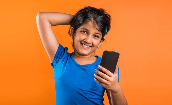 Indian small girl with mobile, asian small girl with mobile, indian girl child and mobile, asian girl clild and mobile, indian small girl posing with mobile, indian girl playing with mobile, selfie