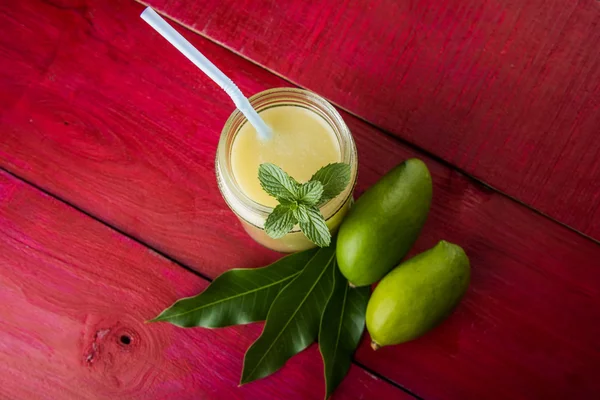 Green mango juice also known as kairi panha, aam panna, Mango Pahna, green mango drink, Fresh green mango smoothie with fresh green mangos