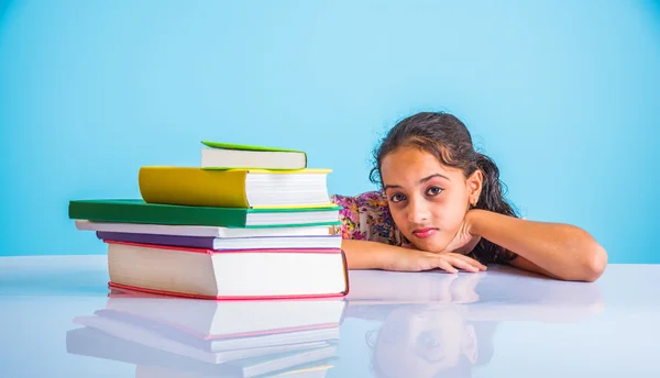 Education and home concept - stressed student girl with books, indian girl child tired of studying or doing homework, asian girl studying and stressed