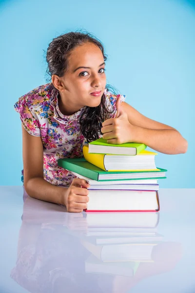 Portrait of confident and smiling indian girl student with pile of books, looking at camera, indian girl studying, asian girl and studying books