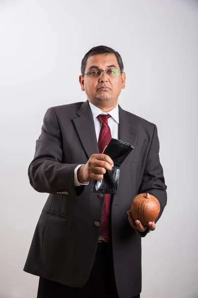 Indian businessman with empty purse, asian businessman with no money in purse for saving, businessman showing empty money purse over white background, indian businessman and bankruptcy concept