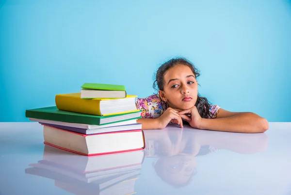 Education and home concept - stressed student girl with books, indian girl child tired of studying or doing homework, asian girl studying and stressed