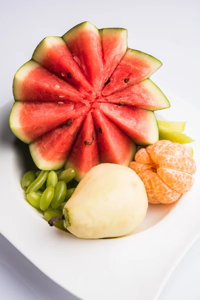 Fruit salad or cut fruits, Diet, healthy fruit salad in the white bowl - healthy breakfast, weight loss concept, Fruit plate, Diet fruit salad in white plate, closeup