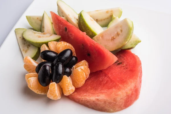 Fruit salad or cut fruits, Diet, healthy fruit salad in the white bowl - healthy breakfast, weight loss concept, Fruit plate, Diet fruit salad in white plate, closeup