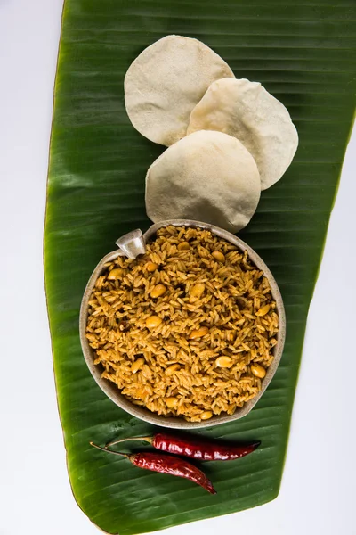 Tamarind Rice or puliyodharai rice and Poppadom from Tamil Nadu, India