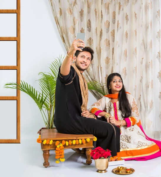 Indian sister taking selfie with brother on Raksha Bandhan festival after tying knot or rakhi