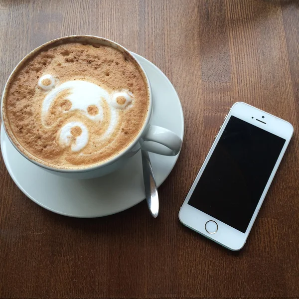 Cup of coffee and smartphone