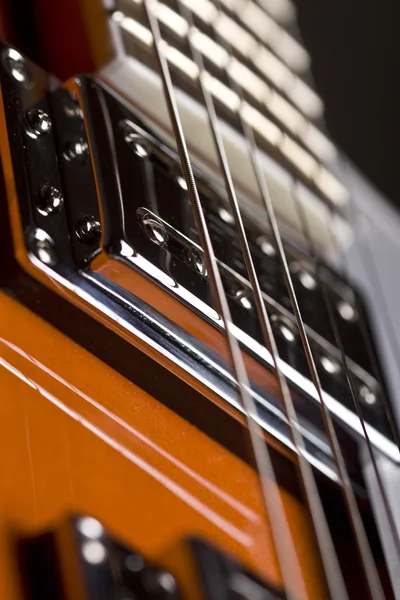 Orange electrical guitar close up