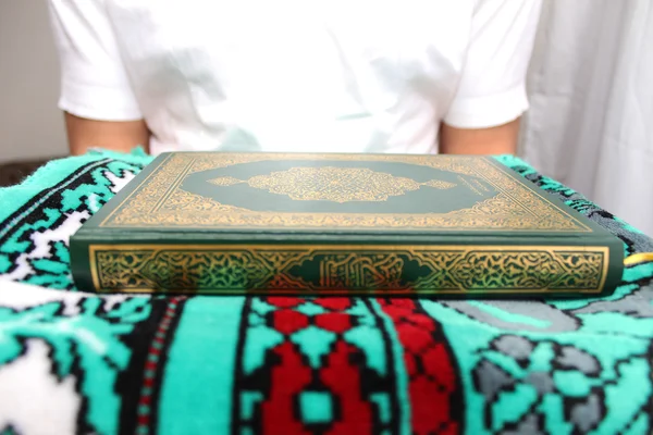 Muslim man Reading Holy Islamic Book Koran