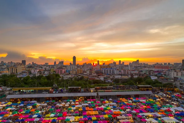 Multi-colored tents of train night market in Bangkok, Thailand