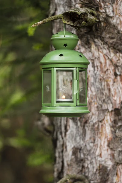 Green lantern with candle