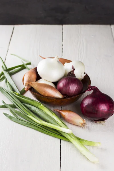 Various grades of onions: white, yellow, red onions, shallot, gr