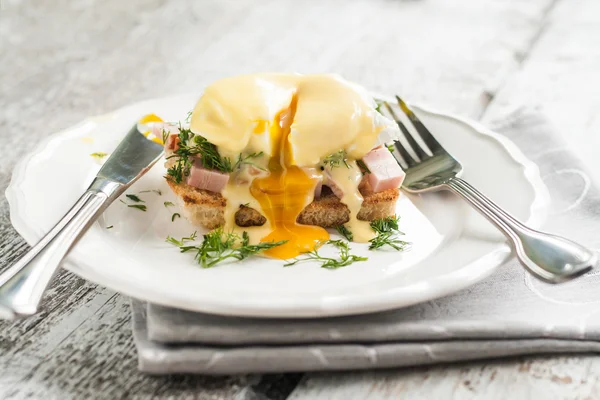 Eggs Benedict in the context of a hollandaise sauce