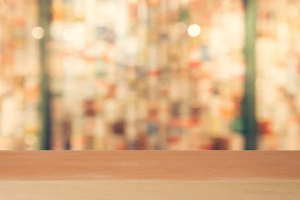 Wooden board empty table in front of blurred background. Perspective brown wood over blur in coffee shop - can be used for display or montage your products.Mock up for display of product.