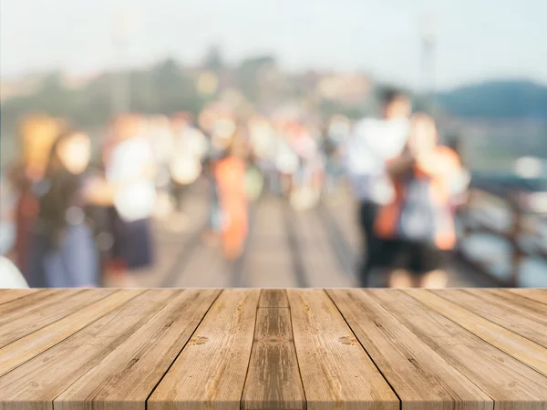 Wooden board empty table in front of blurred background. Perspective brown wood over blur wooden bridge - can be used mock up for display or montage your products. spring season. vintage filtered.