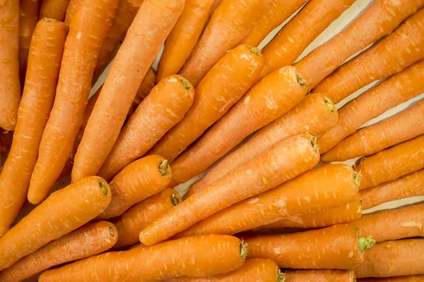The carrot is a root vegetable, usually orange in colour, though