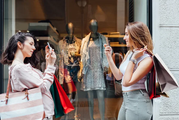 Women making selfie after shopping