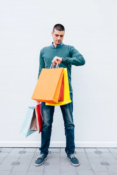 Man holding shopping bags