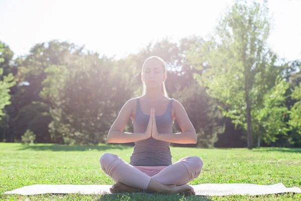 Woman meditating in Lotus pose