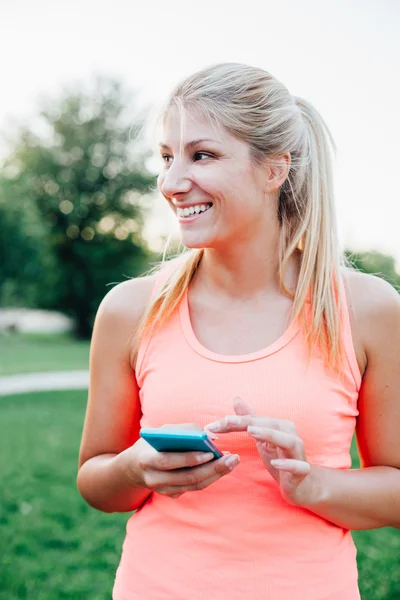 Sports woman using mobile phone