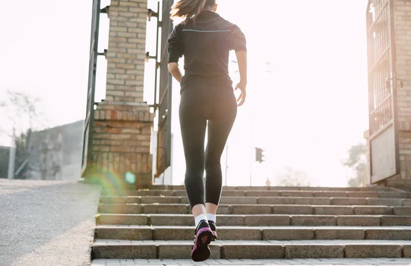 Woman Running Up the Stairs