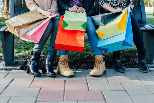 Closeup of girls with colorful shopping bags