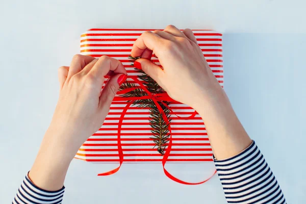 Gift wrapping. Woman packs gifts, step by step