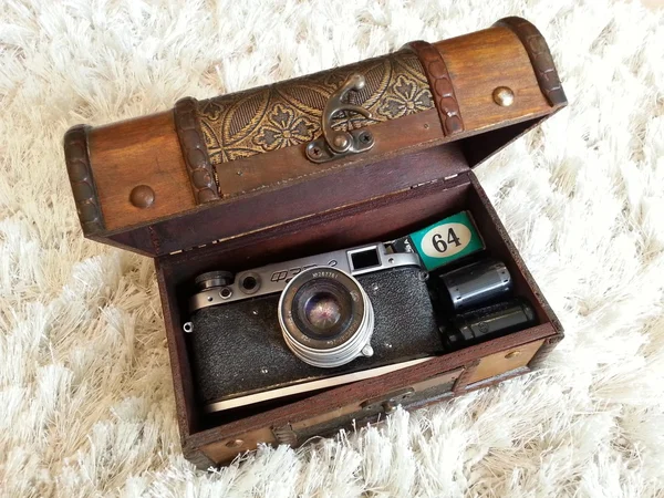 Old camera and films in chest