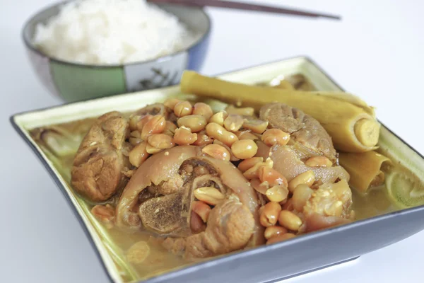 Vietnamese Traditional Food: Ham hock stewed with peanuts, lemongrass and lesser galangal, served ith steamed rice or rice vermicelli