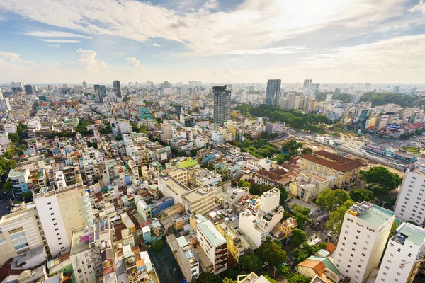 SAIGON, VIETNAM - JUNE 18, 2015. Ho Chi Minh city (or Saigon) skyline with colorful house in sunset, Vietnam. Saigon is the largest city in Vietnam with population around 10 million people.