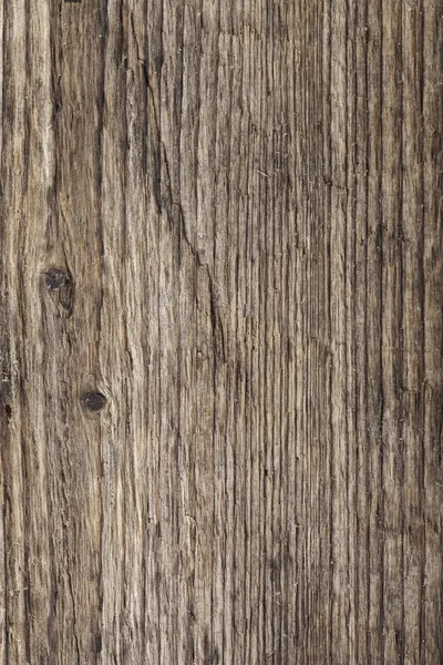 Vertical texture of old rotten wood closeup