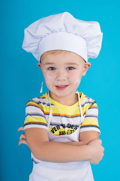 The young chef, pastry chef dressed in  clothes chef
