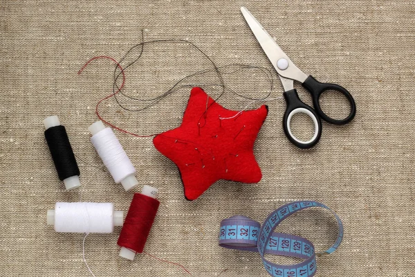 Pin cushion with needles, thread