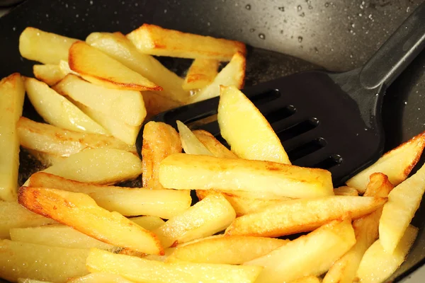 Young potatoes fried in boiling oil