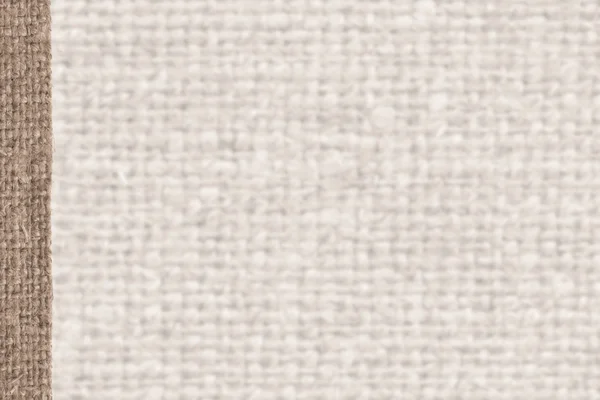 Textile tissue, fabric industry, beige canvas, jutesack material, house background