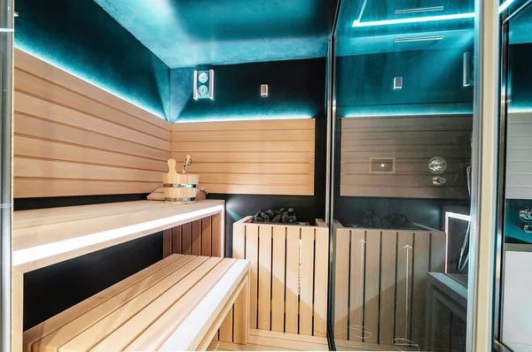 Modern Finnish sauna with neon lights. Beautiful interior home.